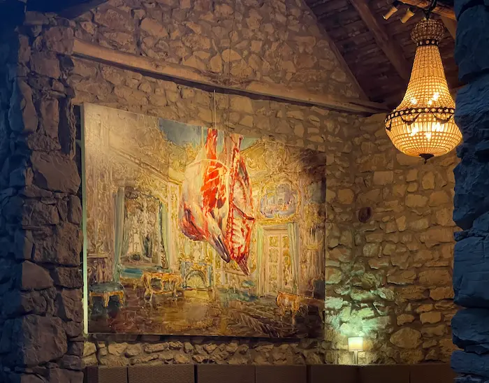 Artist studio with large bull painting and wooden beams