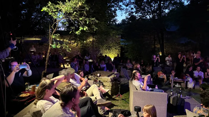 Evening audience gathering at blue hour