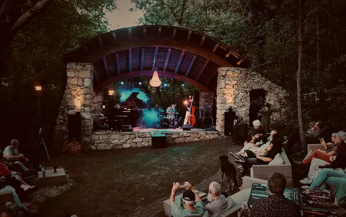 Artist studio with large bull painting and wooden beams